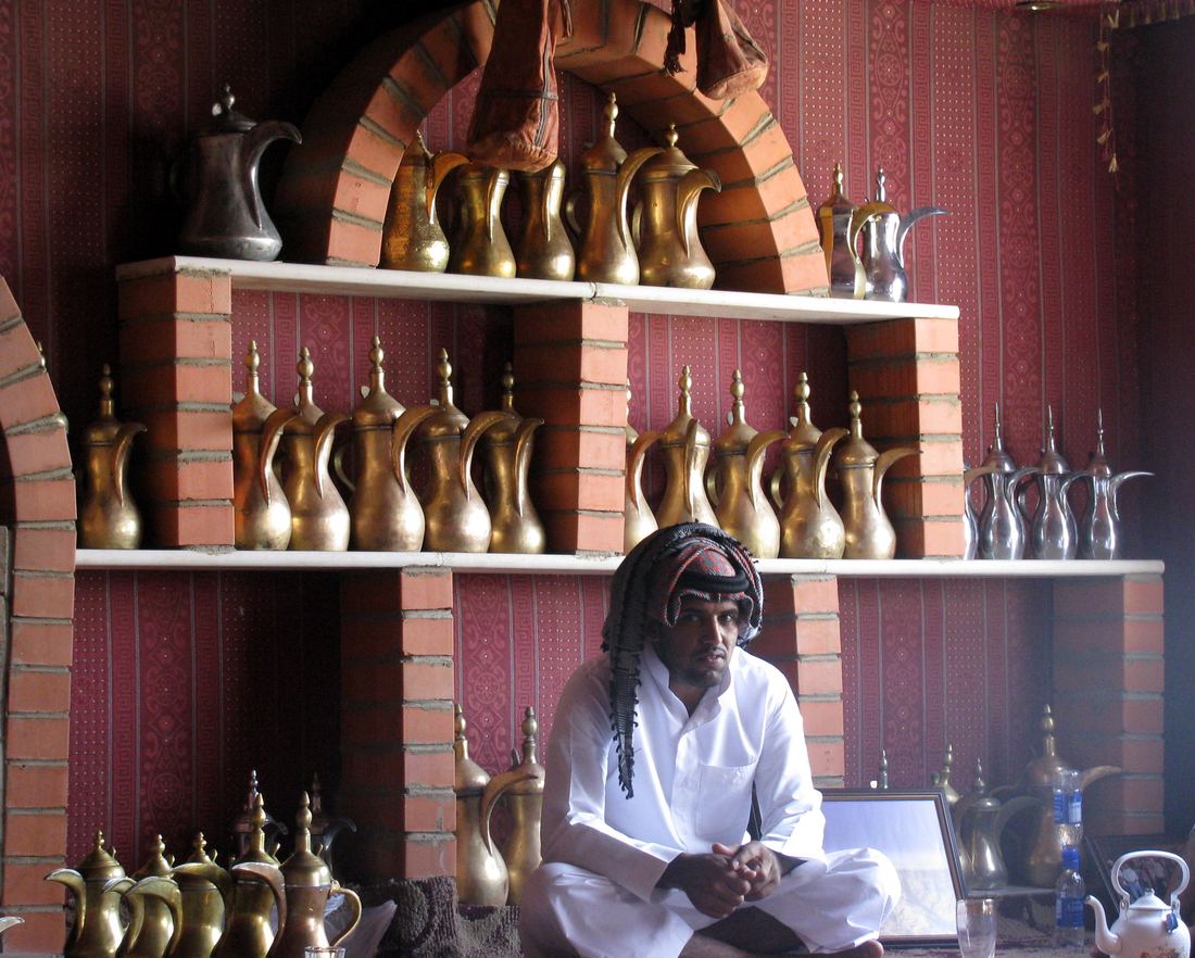 Row of Arabic coffee pots set out for guests