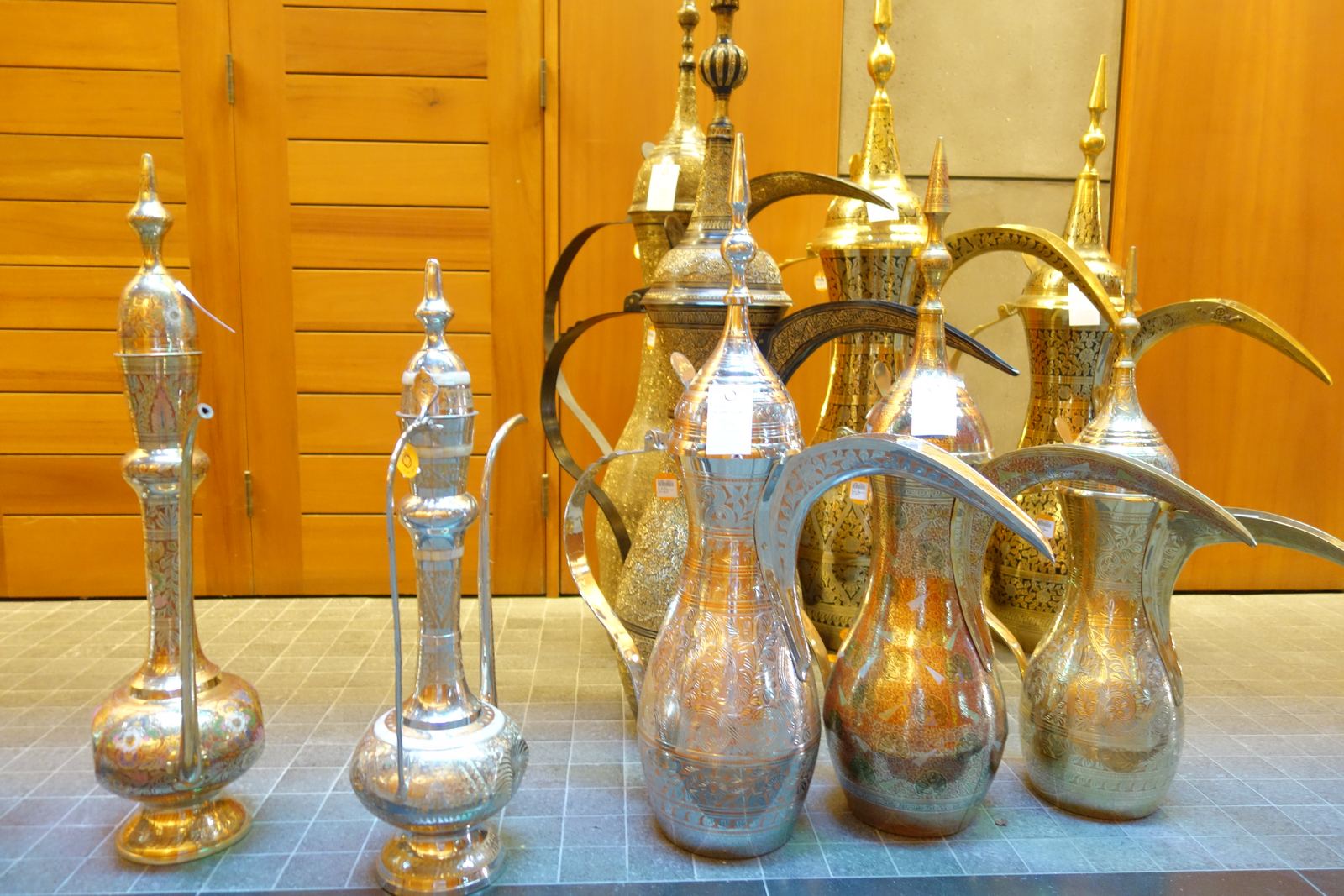 A dallah pot of Arabic coffee with small cups