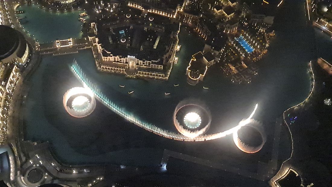 Dubai Fountain jets lit at night